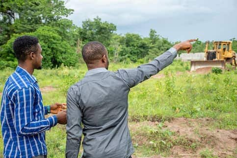 Stock Two Young African Men Surveying A Piece Of Land AdobeStock 351999988 copy